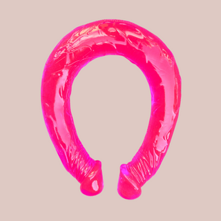 The pink double ended dildo from House of Chastity, it is very bendable and has veins running through the full length.