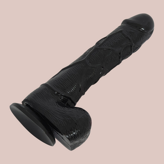 The Black 7 Inch Dildo from House of Chastity, you can see the realistic head, veining and balls, as well as the sucker base.