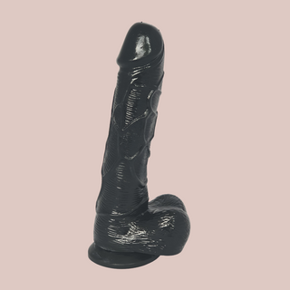 The Black 7 Inch Dildo from House of Chastity, you can see the realistic head, veining and balls, as well as the sucker base.