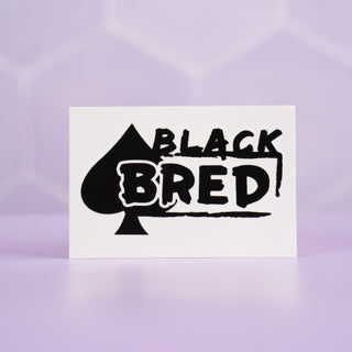 A close up of the Black Bred tattoo, you can see the spade and Black Bred text.