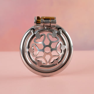 A forwards facing view of the cage of hearts chastity cage, showing the detail on the front of the cage.