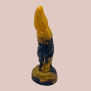 The Calira Gold Dragon Series Dildo, a gold and black dildo.