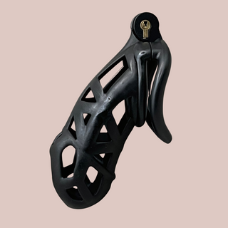The Cobra Curved Cuff Maxi chastity cage in black, it is shown fully assembled with its integral lock and curved base ring.