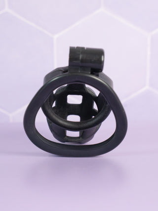 A rear view of the Cobra Double Cuff Chastity Cage Kit shown from a rear view, you can see through the base ring and into the chastity cage.