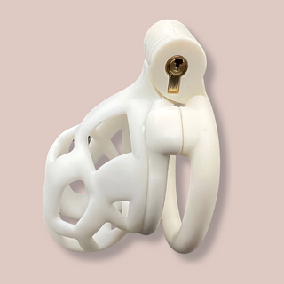 A side view of the fully assembled Cobra Flat Cuff Nano chastity cage in White. The cage is shown fully assembled and with the integral lock fitted.