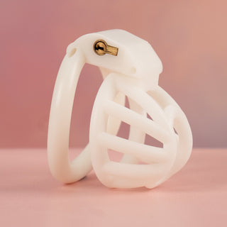 A side view of the whjite Cobra Nub chastity cage, the cock cage is shown fully assembled.