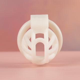 The White Cobra Nub chastity cage from a front view, you can see the open end that allows for urination during wear.