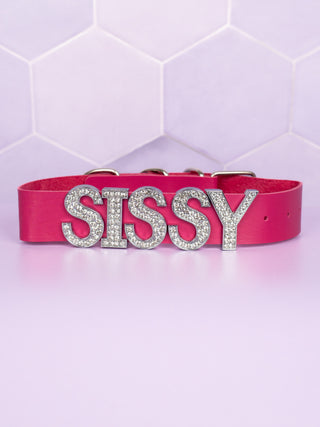 The bright pink collar with Sissy in diamante lettering shown here buckled up. The colours this collar are available in are black, bright pink and pale pink.