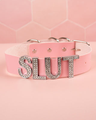 A picture of the front of the diamante slut collar in the pink colourway.