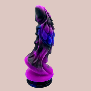 The Dragon Force Dildo shown from a side view, you can see the sculpted pattern and mottle colouring.