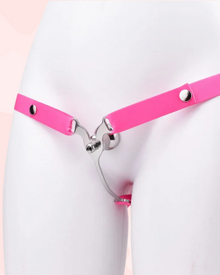 A front view of the Femme Fantasy Chastity Cage with pink belt fitted, it is shown on a model.