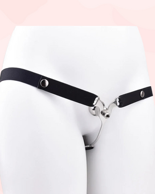 A front view of the Femme Fantasy Chastity Cage with black belt fitted, it is shown on a model.