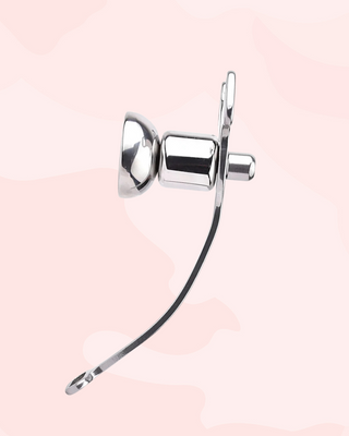 A side view of the Femme Fantasy Chastity Cage and the urethral cup.