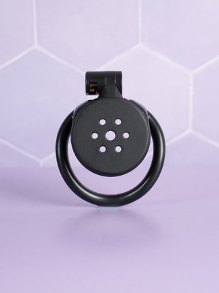 A front view of the flat gatling black chastity cage.