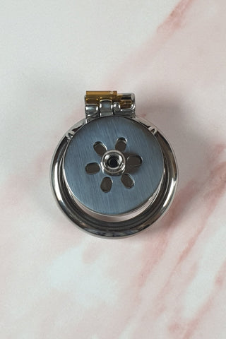 The Flat Gatling Thruster Chastity Cage  is shown from the front view, the urethral cup is fitted