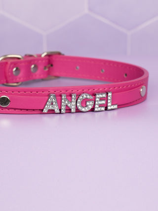 A close up of the rhinestone Angel lettering on the hot pink collar