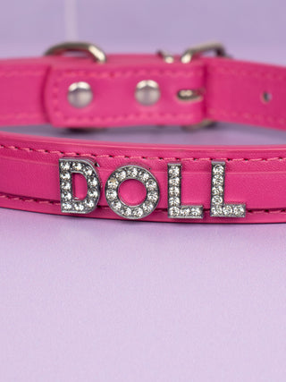 A close up of the Doll rhinestone lettering