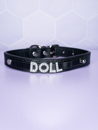 The Glimmer Doll collar in black with the Doll rhinestone lettering