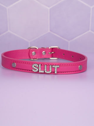The hot pink collar with Slut in rhinestone lettering.