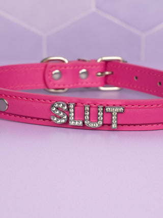 A close up of the rhinestone SLUT lettering.