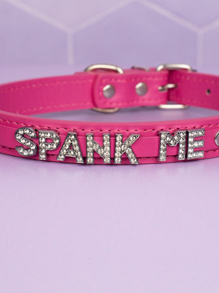 A close up of the diamante Spank Me lettering.