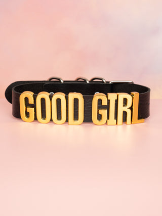 The Good Girl Collar in black with gold lettering, you can see the block gold lettering .