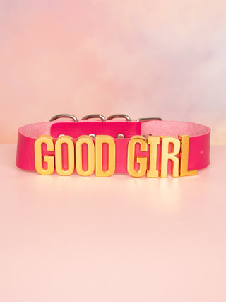 The Good Girl Collar in bright pink with gold lettering.