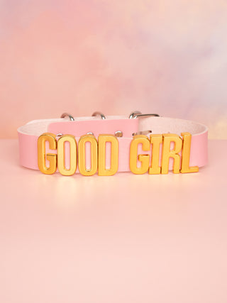 The Good Girl Collar in pale pink with gold lettering.
