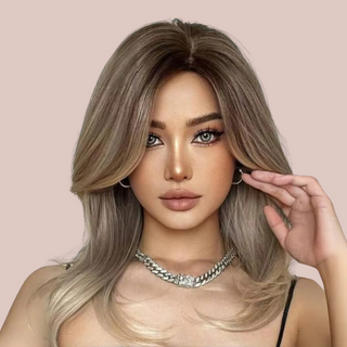 The swept back long length wig modelled for House of Chastity. Fashionable swept back long layered wig in blonde. Front view