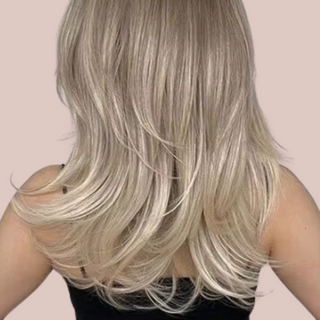 A back view of the HOC1002-2 wig from House of Chastity, you can see the blonde colouring with deep variety of blonde tints, the fashionable layered shaping and the shoulder draping length.