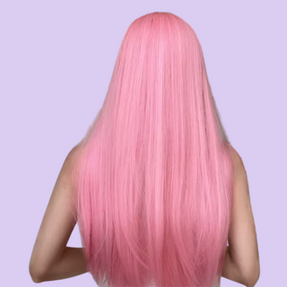 A back view of the bubble gum pink wig, the colour is vibrant and the hair is long.