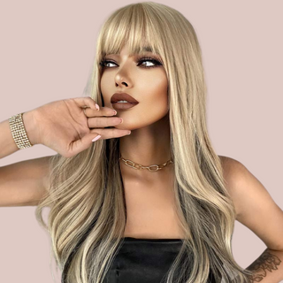 The Long Straight Flowing Ombre Blonde wig from House Of Chastity being modelled. You can see the soft long style blonde locks with fringe.