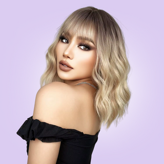 The soft wave wig has a beautiful balayage dark roots falling to softer lighter blonde tresses.