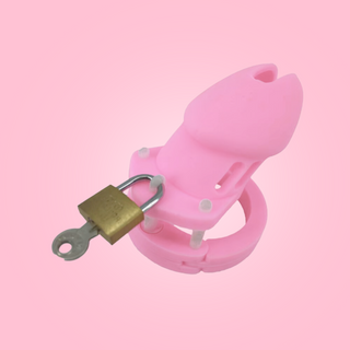 The HOC600 Silicone Small chastity cage is shown here in pink fully assembled with the padlock in place and the key ready to be removed.