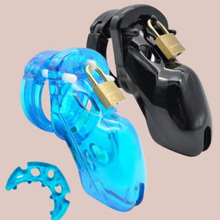 Showing The House Of Chastity 600HOC chastity cage with anti-off ring. This shows the neon blue and black cock cages fully assembled and the padlock in place, sat to the side is one of the anti -off rings to show the type of anti-off ring is included. The anti-off ring will colour co-ordinate with your chastity cage.