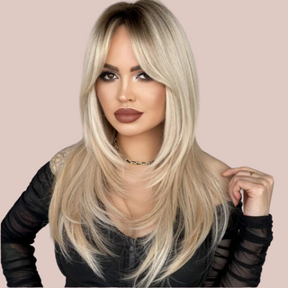 A long blonde ombre wig with soft layering to the sides and long fringe to create a very soft hairstyle