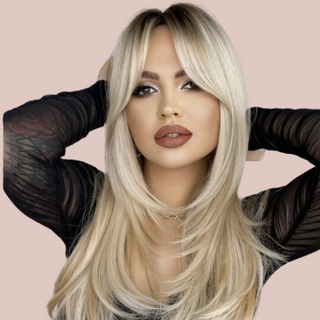 A long blonde ombre wig with soft layering to the sides and long fringe to create a very soft hairstyle