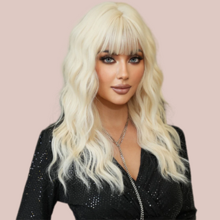 HOC9262-2 Platinum Blonde Soft Wave Long Length Hair modelled for House of Chastity. Long length platinum blonde wig, in the images the curls have been teased into soft waves and along with the long length fringe it creates a very soft look.