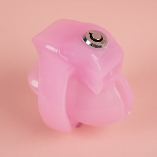 The HT V5 Nub chastity cage shown here in pink, you can see the push lock is in place and the base ring is fitted.