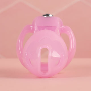 A front on view of the HT V5 chastity cage in pink, you can see the air and urination holes built into the cage.