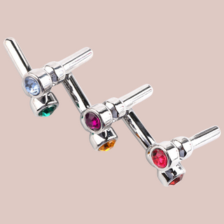 All colours of the jewelled urethral dilator. Shown is blue, green , pink, yellow, pink and red.