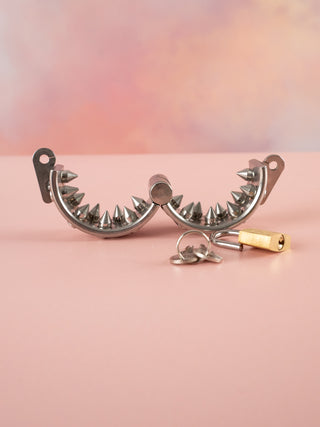 A open view of the Kalis teeth chastity cage showing what it looks like when opened.