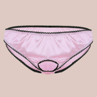 Pale pink satin panties from House Of Chastity, you can see the black edging which is also around the open ring front.