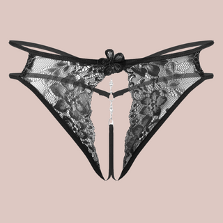 A close up of the black Open Front Floral Lace G-String from House Of Chastity, they are shown flat.