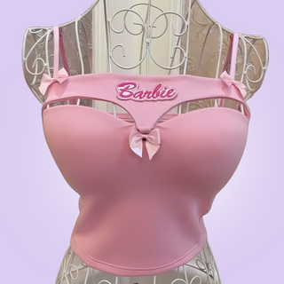 The Peekaboo Crop Top is shown on a mannequin, you can see the decorative bows.