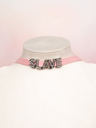 The SLAVE necklace is shown bein modelled on a neck mannequin.