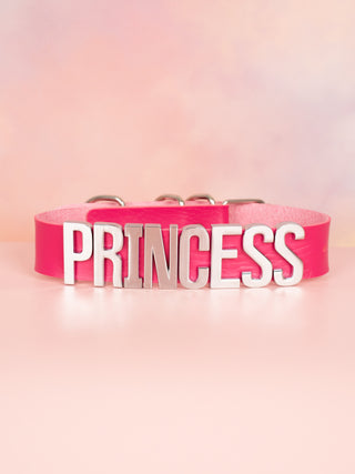 The bright pink leather collar with silver Princess lettering