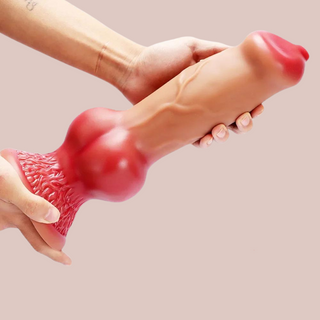 A close up of the XXL flesh and red dildo