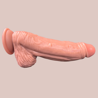 A side view of the Flesh Pink Realistic Giant Dildo