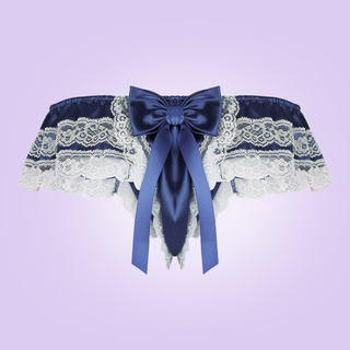 The rear view of the satin and lace tanga panties. You can see the large bow at the rear and the decorative lace edging.